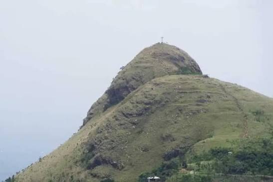 The Mount Gemi peak with its summit cross seen from a distance
